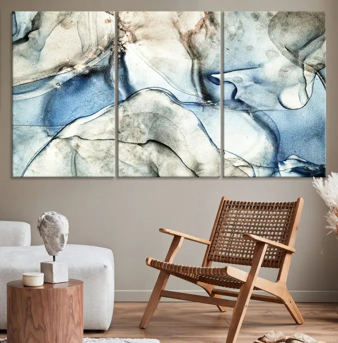 Introducing the Marble Fluid Effect Wall Art Abstract Canvas Wall Art Print, featuring a stunning triptych design with blue and beige swirls on museum-quality canvas.