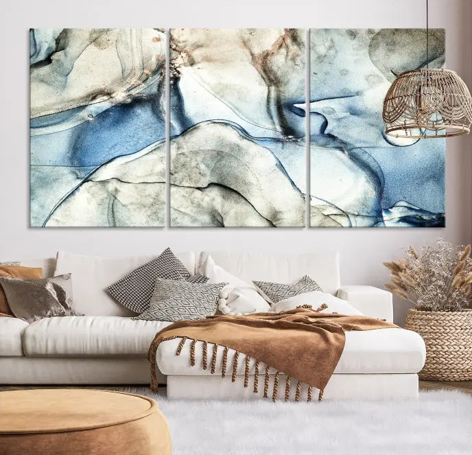 Introducing the Marble Fluid Effect Wall Art Abstract Canvas Wall Art Print, featuring a stunning triptych design with blue and beige swirls on museum-quality canvas.