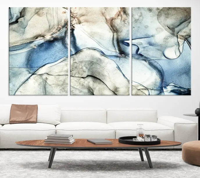 Introducing the Marble Fluid Effect Wall Art Abstract Canvas Wall Art Print, featuring a stunning triptych design with blue and beige swirls on museum-quality canvas.