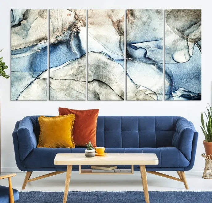 Introducing the Marble Fluid Effect Wall Art Abstract Canvas Wall Art Print, featuring a stunning triptych design with blue and beige swirls on museum-quality canvas.