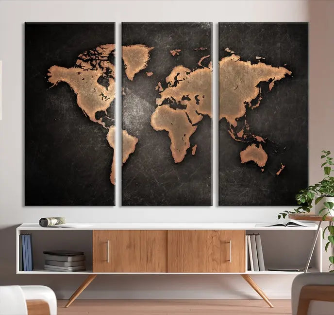 The Maroon World Map Wall Art Canvas Print, comprising three panels, showcases a golden world map on a dark background. Crafted on museum-quality canvas with a UV-protective coating, it arrives ready to hang and adds an elegant touch to any space.