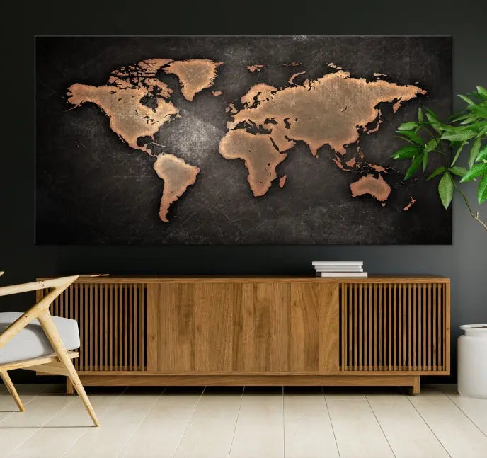 The Maroon World Map Wall Art Canvas Print, comprising three panels, showcases a golden world map on a dark background. Crafted on museum-quality canvas with a UV-protective coating, it arrives ready to hang and adds an elegant touch to any space.