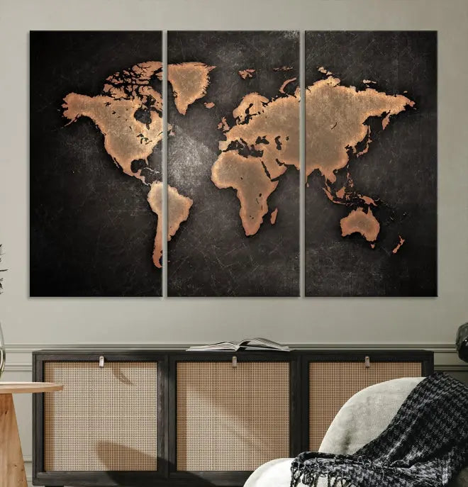 The Maroon World Map Wall Art Canvas Print, comprising three panels, showcases a golden world map on a dark background. Crafted on museum-quality canvas with a UV-protective coating, it arrives ready to hang and adds an elegant touch to any space.