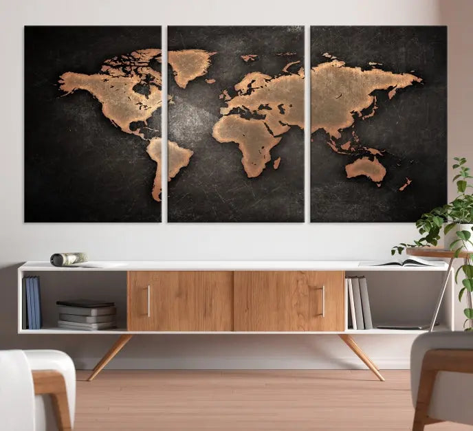 The Maroon World Map Wall Art Canvas Print, comprising three panels, showcases a golden world map on a dark background. Crafted on museum-quality canvas with a UV-protective coating, it arrives ready to hang and adds an elegant touch to any space.