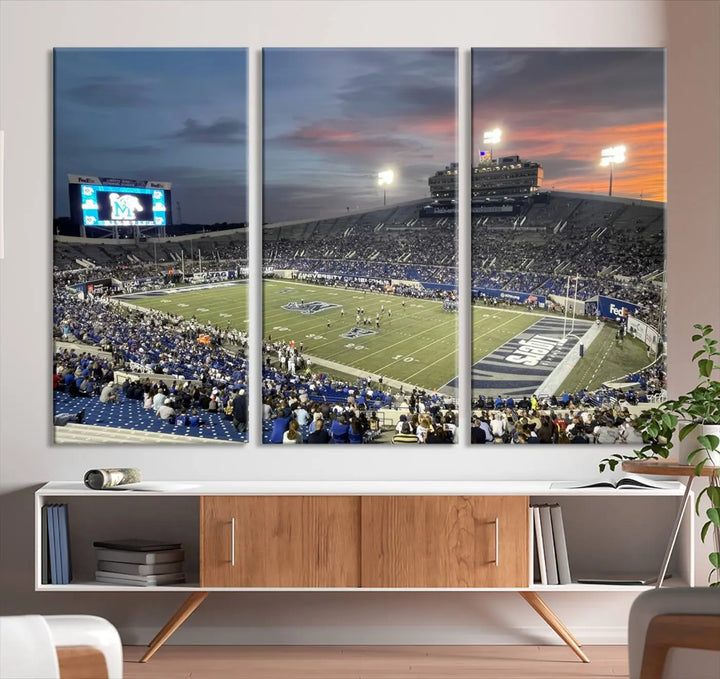 The "Memphis Tigers Football Team Print" is a triptych canvas, printed in high-resolution with vibrant colors, spotlighting the Memphis Simmons Bank Liberty Stadium at sunset. The scene beautifully captures a thrilling game in progress and the lively crowd, all rendered on museum quality canvas.