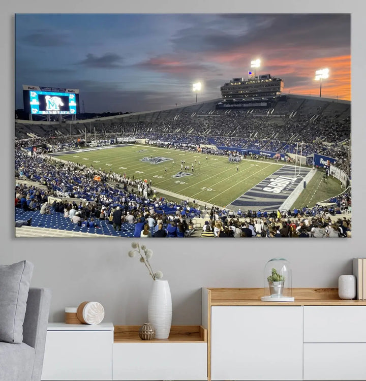 The "Memphis Tigers Football Team Print" is a triptych canvas, printed in high-resolution with vibrant colors, spotlighting the Memphis Simmons Bank Liberty Stadium at sunset. The scene beautifully captures a thrilling game in progress and the lively crowd, all rendered on museum quality canvas.