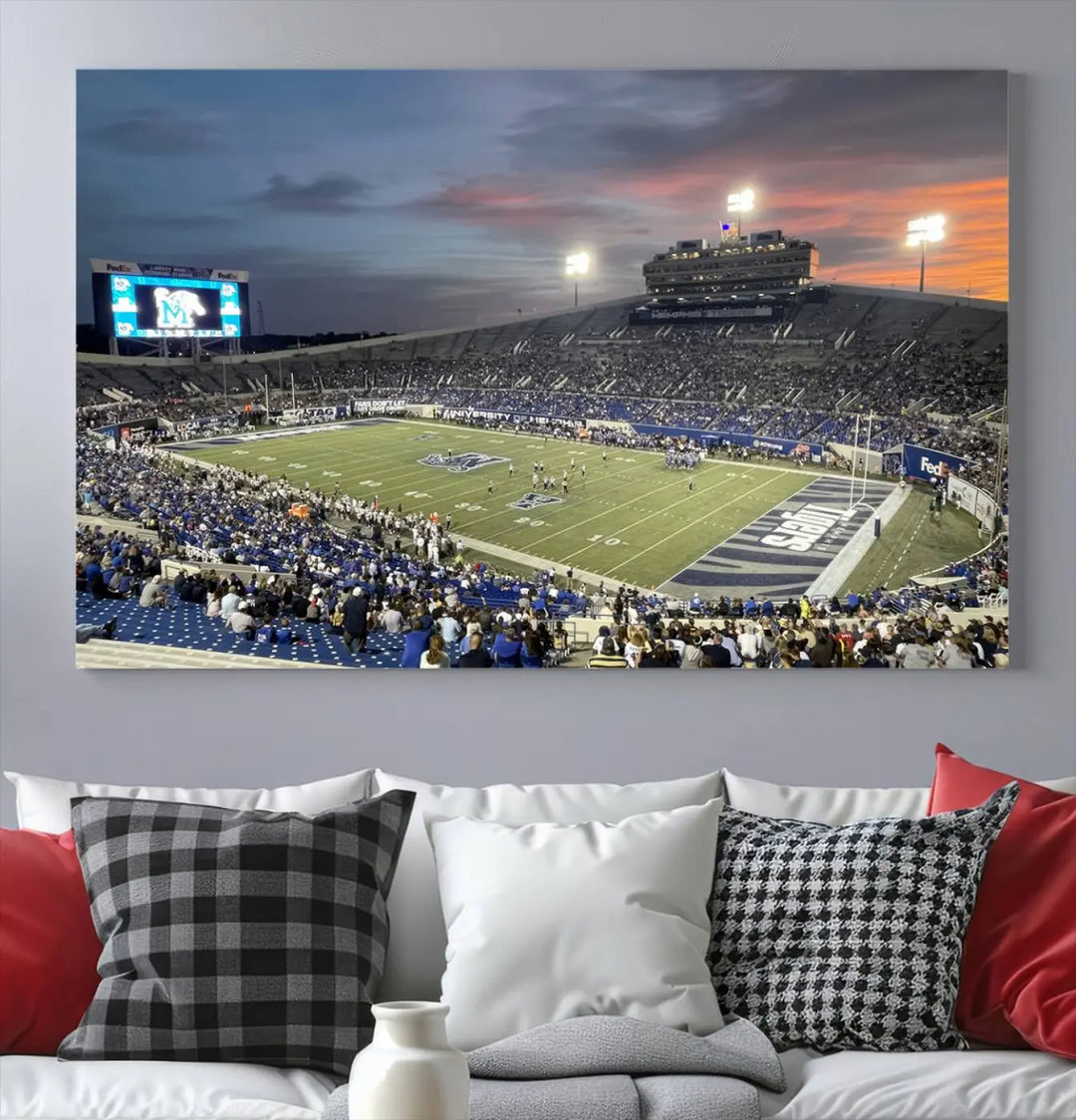 The "Memphis Tigers Football Team Print" is a triptych canvas, printed in high-resolution with vibrant colors, spotlighting the Memphis Simmons Bank Liberty Stadium at sunset. The scene beautifully captures a thrilling game in progress and the lively crowd, all rendered on museum quality canvas.