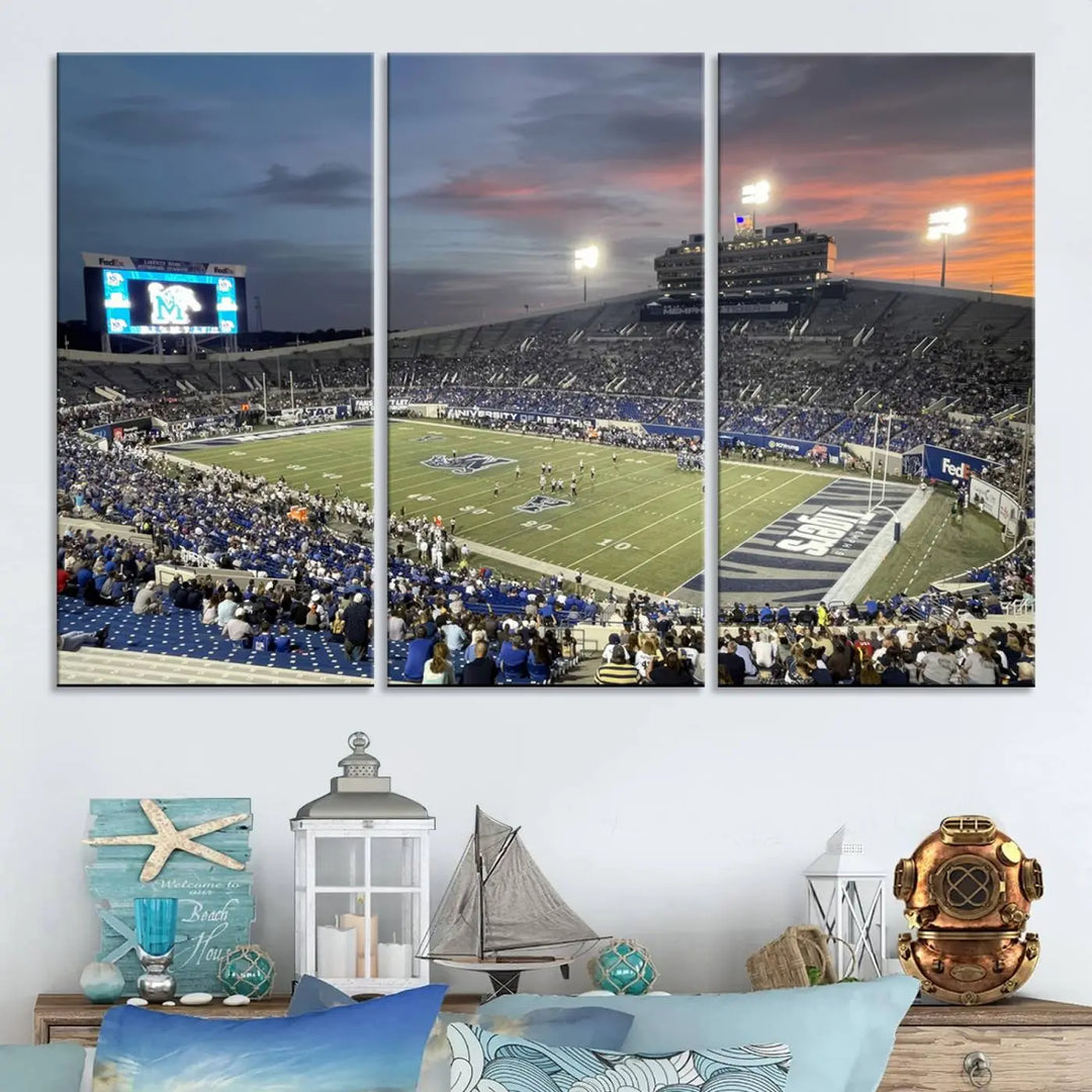 The "Memphis Tigers Football Team Print" is a triptych canvas, printed in high-resolution with vibrant colors, spotlighting the Memphis Simmons Bank Liberty Stadium at sunset. The scene beautifully captures a thrilling game in progress and the lively crowd, all rendered on museum quality canvas.