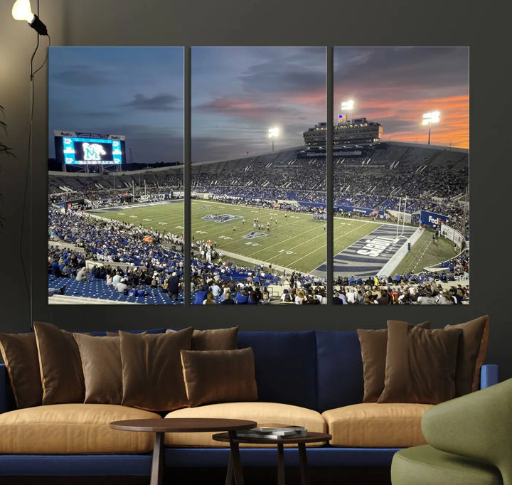 The "Memphis Tigers Football Team Print" is a triptych canvas, printed in high-resolution with vibrant colors, spotlighting the Memphis Simmons Bank Liberty Stadium at sunset. The scene beautifully captures a thrilling game in progress and the lively crowd, all rendered on museum quality canvas.