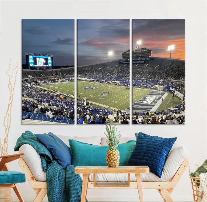 The "Memphis Tigers Football Team Print" is a triptych canvas, printed in high-resolution with vibrant colors, spotlighting the Memphis Simmons Bank Liberty Stadium at sunset. The scene beautifully captures a thrilling game in progress and the lively crowd, all rendered on museum quality canvas.