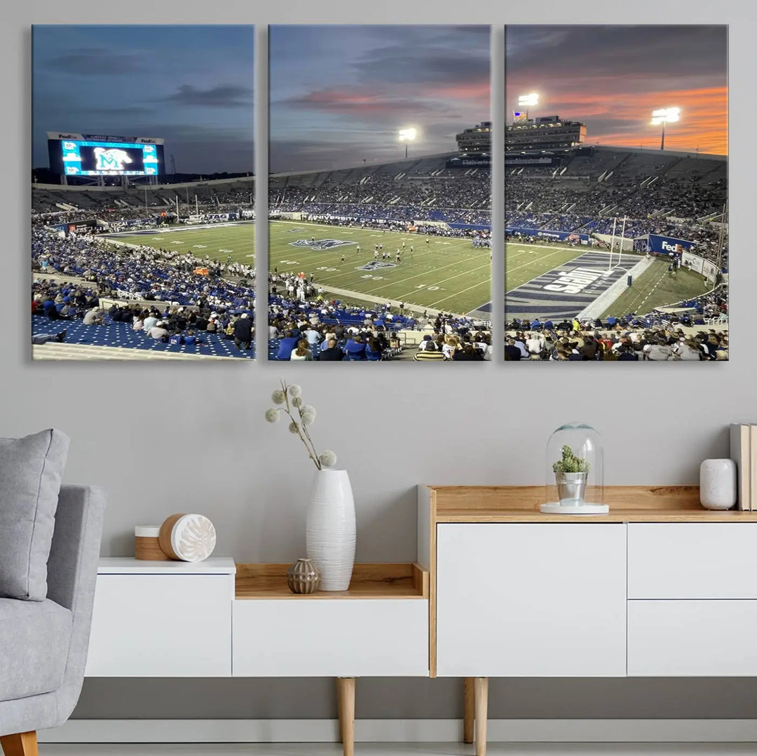 The "Memphis Tigers Football Team Print" is a triptych canvas, printed in high-resolution with vibrant colors, spotlighting the Memphis Simmons Bank Liberty Stadium at sunset. The scene beautifully captures a thrilling game in progress and the lively crowd, all rendered on museum quality canvas.