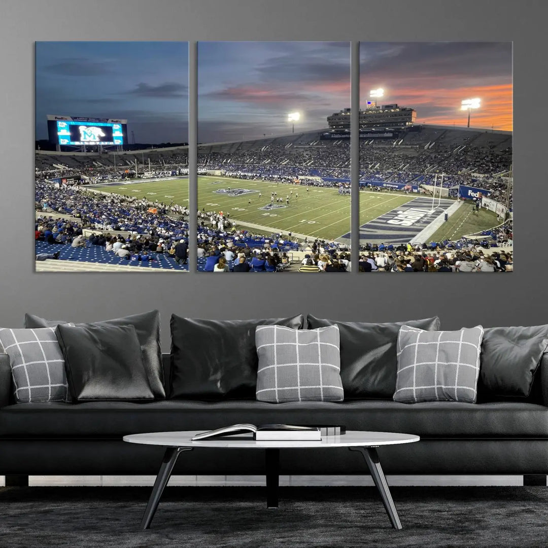 The "Memphis Tigers Football Team Print" is a triptych canvas, printed in high-resolution with vibrant colors, spotlighting the Memphis Simmons Bank Liberty Stadium at sunset. The scene beautifully captures a thrilling game in progress and the lively crowd, all rendered on museum quality canvas.