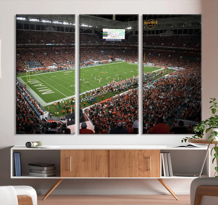 The Miami Hurricanes Football Team Print, showcasing the energetic Miami Hard Rock Stadium filled with fans, is a premium canvas print that offers a gallery-quality finish, ideal for enhancing your space.