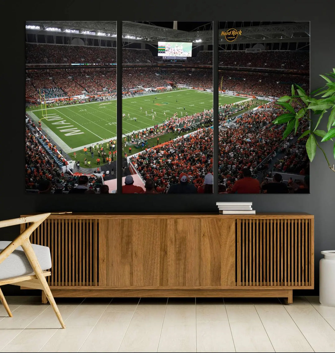 The Miami Hurricanes Football Team Print, showcasing the energetic Miami Hard Rock Stadium filled with fans, is a premium canvas print that offers a gallery-quality finish, ideal for enhancing your space.