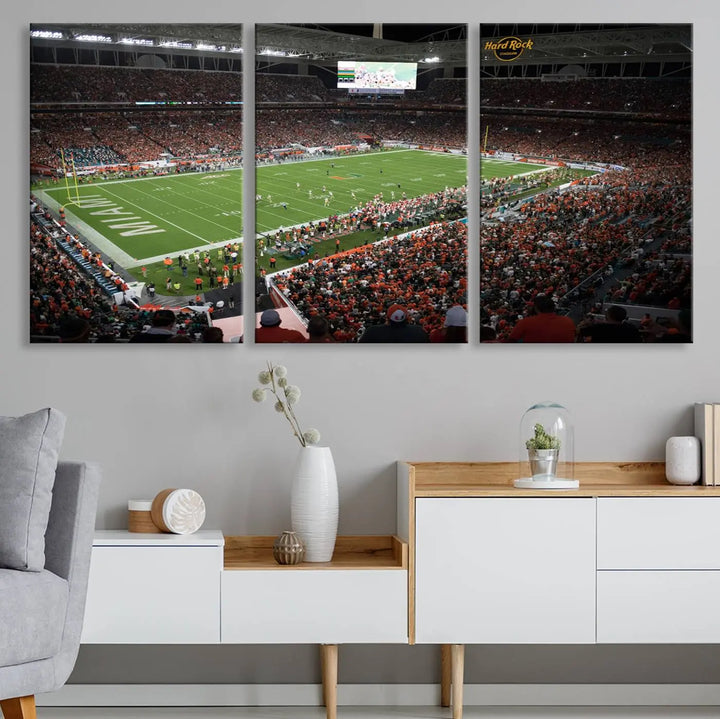 The Miami Hurricanes Football Team Print, showcasing the energetic Miami Hard Rock Stadium filled with fans, is a premium canvas print that offers a gallery-quality finish, ideal for enhancing your space.