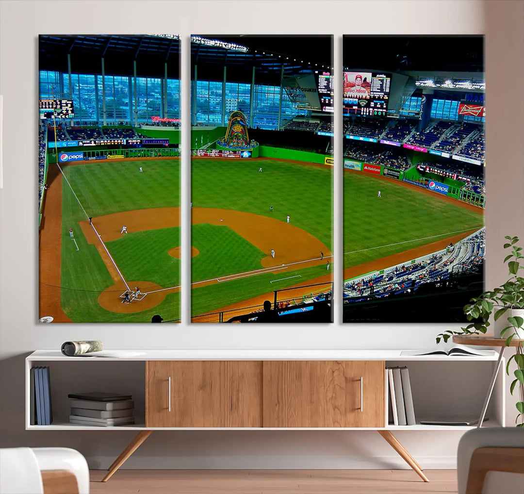 A striking three-panel Miami Marlins wall art of the LoanDepot Park stadium hangs above, enhancing the space with its premium canvas and gallery-quality finish.