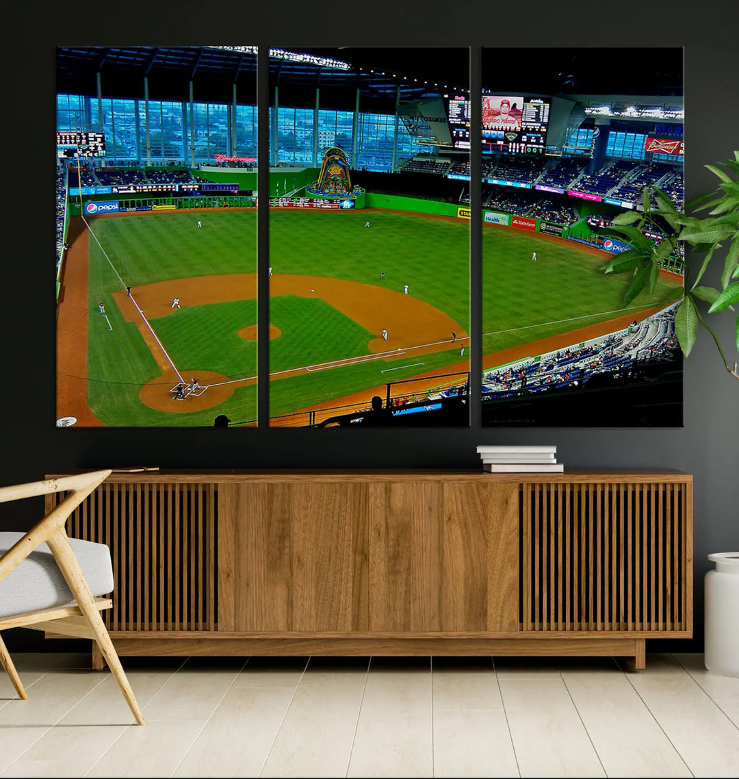 A striking three-panel Miami Marlins wall art of the LoanDepot Park stadium hangs above, enhancing the space with its premium canvas and gallery-quality finish.