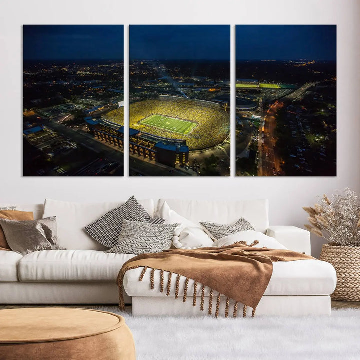 The vibrant energy of game day is perfectly captured in the Michigan Stadium Night Game Wall Art – Sports Arena Aerial View Canvas Print, framed and ready to hang.