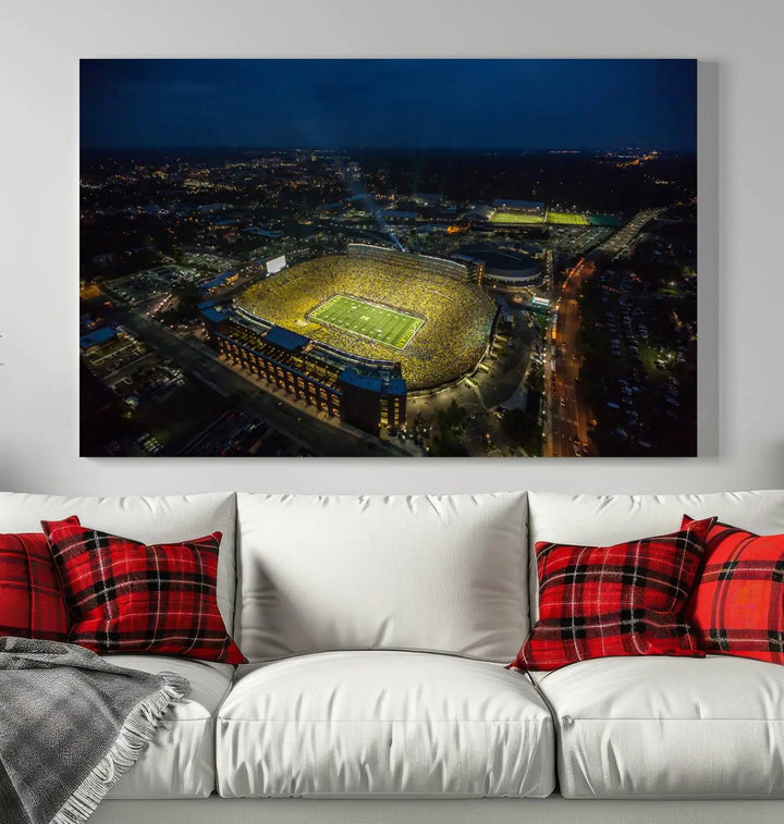 The vibrant energy of game day is perfectly captured in the Michigan Stadium Night Game Wall Art – Sports Arena Aerial View Canvas Print, framed and ready to hang.