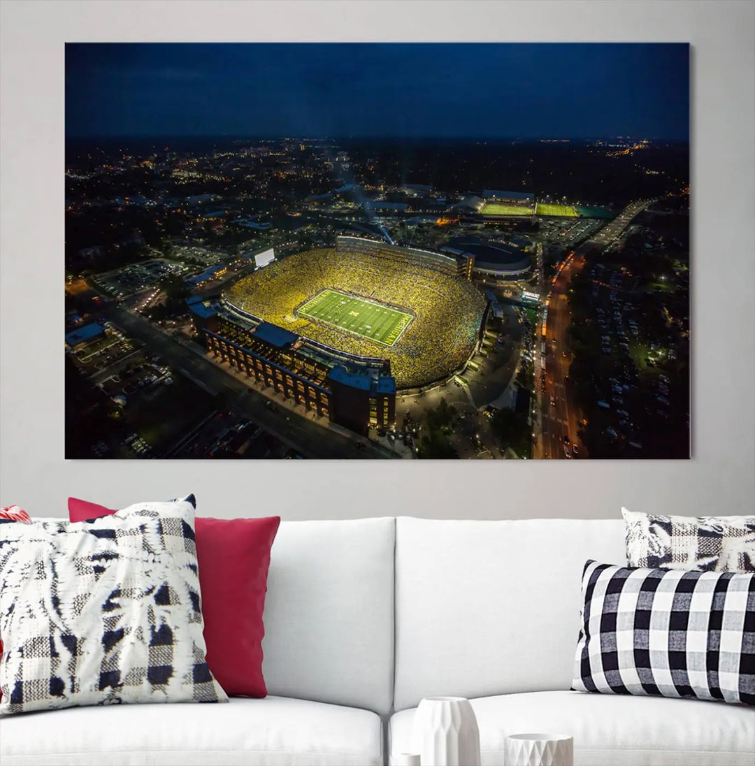 The vibrant energy of game day is perfectly captured in the Michigan Stadium Night Game Wall Art – Sports Arena Aerial View Canvas Print, framed and ready to hang.