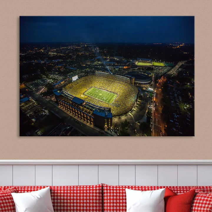 The vibrant energy of game day is perfectly captured in the Michigan Stadium Night Game Wall Art – Sports Arena Aerial View Canvas Print, framed and ready to hang.