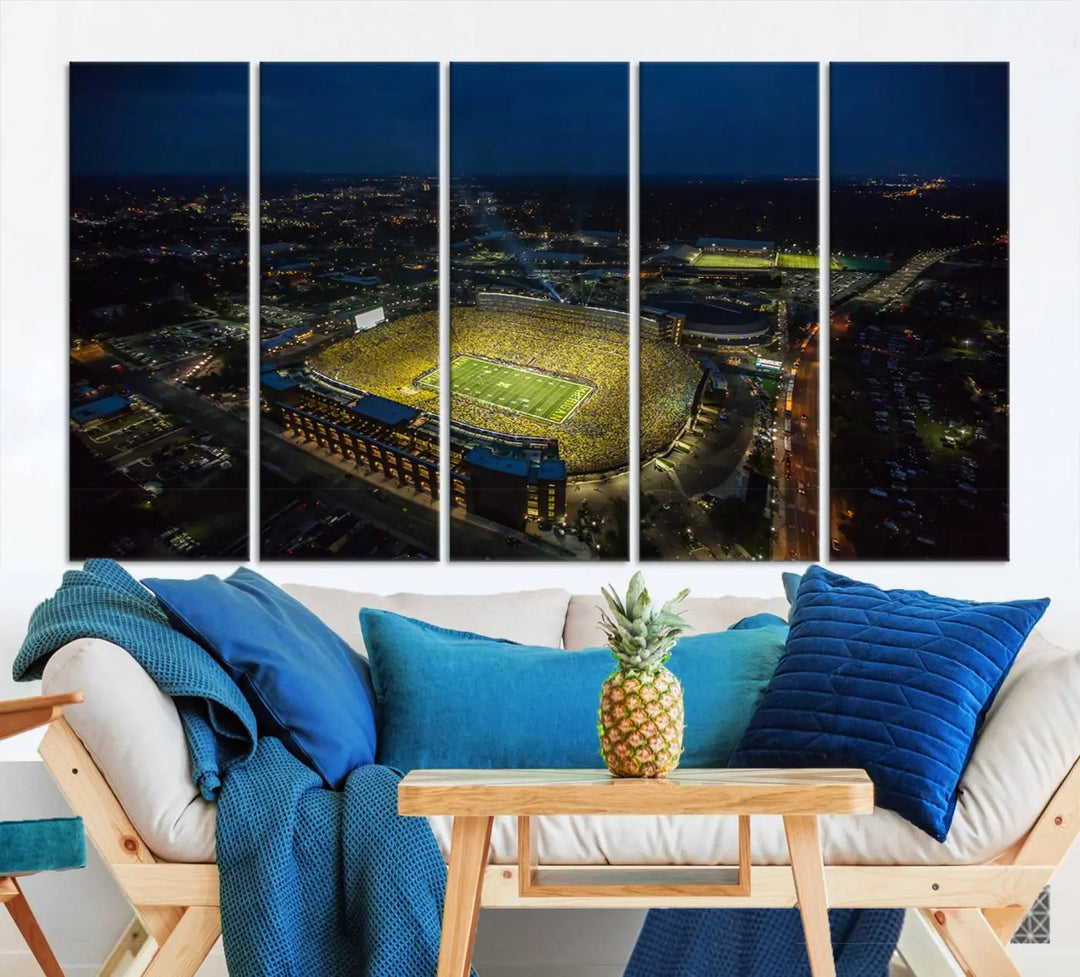 The vibrant energy of game day is perfectly captured in the Michigan Stadium Night Game Wall Art – Sports Arena Aerial View Canvas Print, framed and ready to hang.