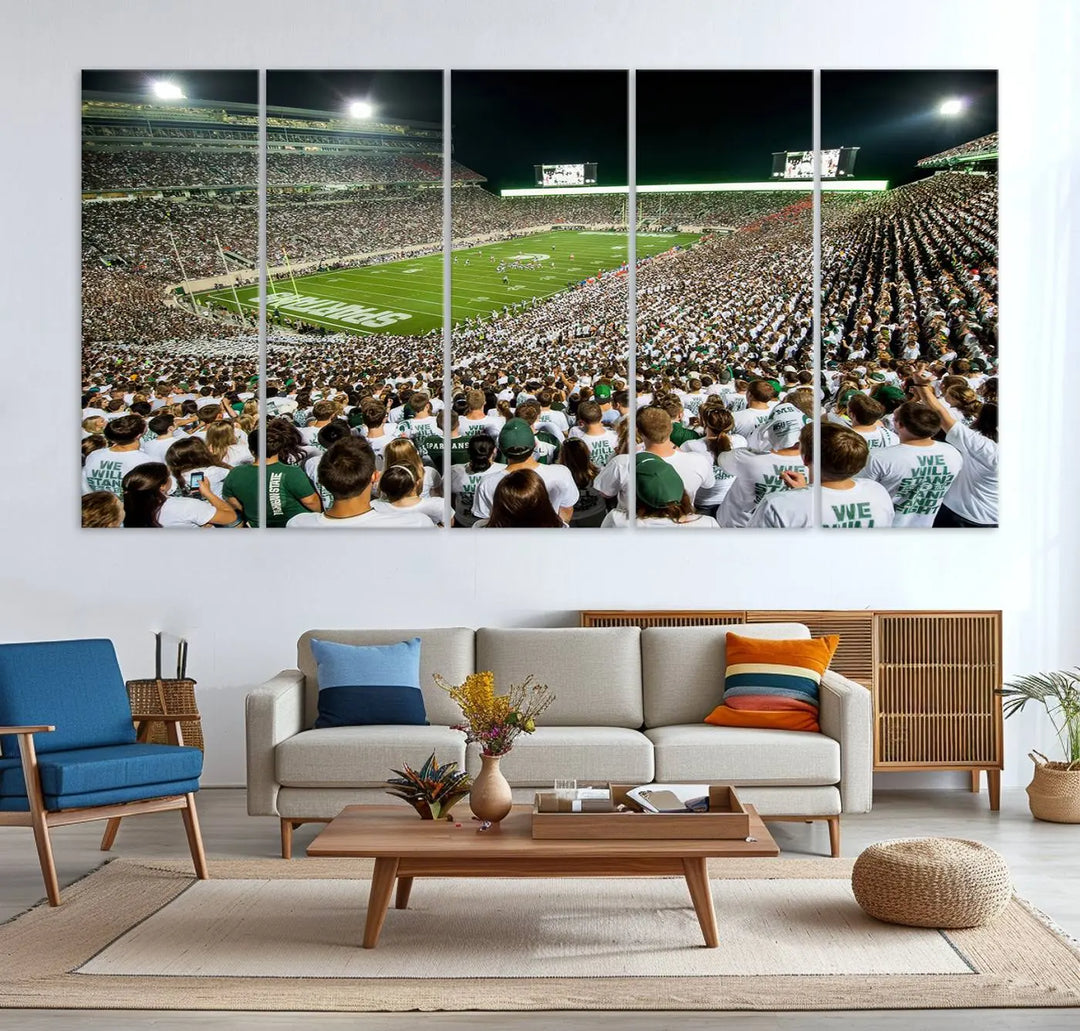 Above the dining table, a gallery-quality Michigan State Spartans Football Team Print on premium canvas is displayed, featuring a panoramic view of East Lansing's Spartan Stadium.