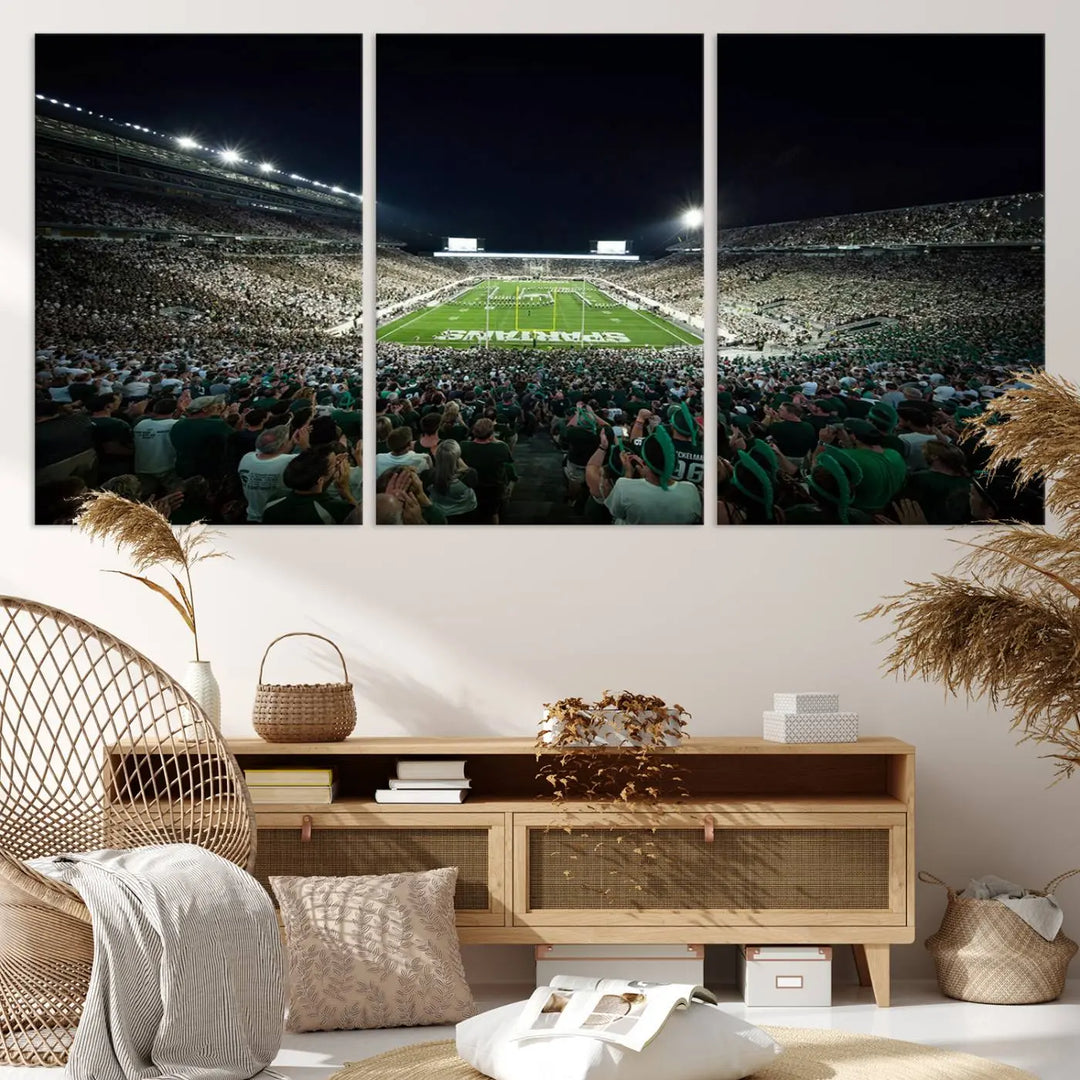 The Michigan State Spartans Football Team Print features an impressive depiction of East Lansing's Spartan Stadium at night, packed with enthusiastic fans. This captivating wall art boasts a gallery-quality finish that enchants any viewer.