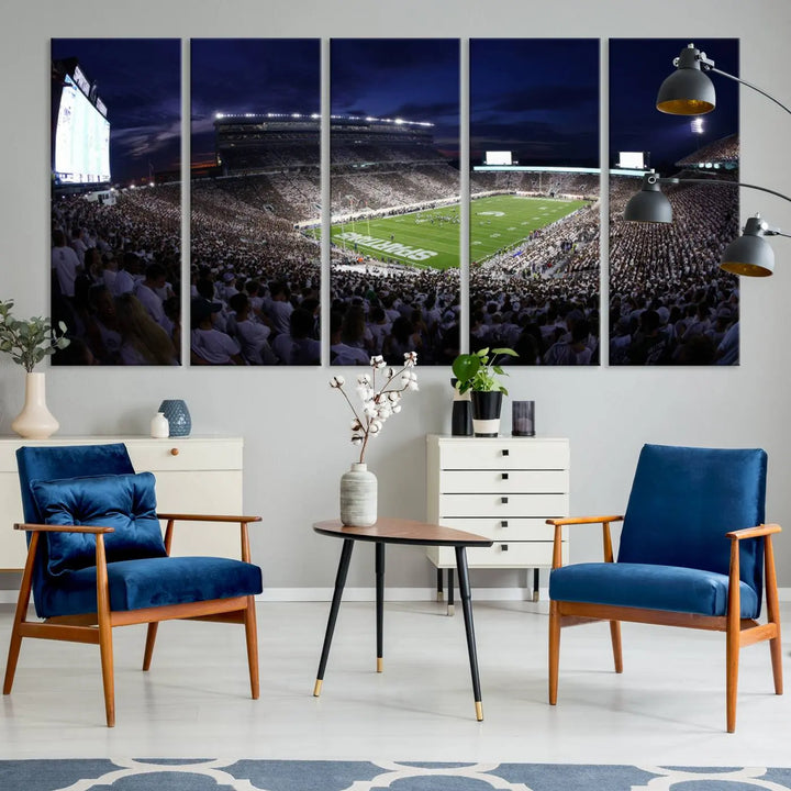 The living room features a wall adorned with a triptych of the Michigan State Spartans Football Team Print - East Lansing Spartan Stadium Wall Art Canvas Print.