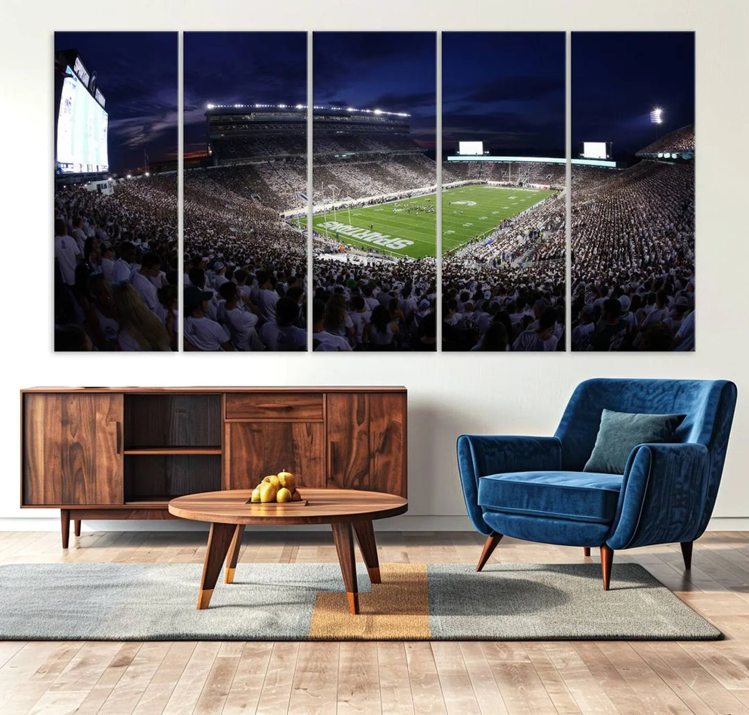 The living room features a wall adorned with a triptych of the Michigan State Spartans Football Team Print - East Lansing Spartan Stadium Wall Art Canvas Print.