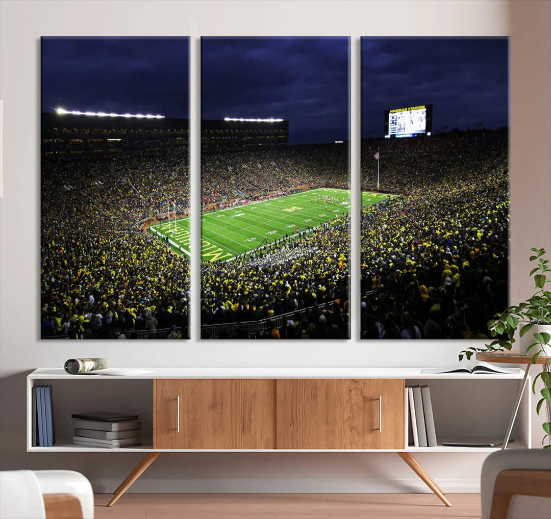 Transform your space with the exhilarating Michigan Wolverines Football Team Print, featuring Ann Arbor's iconic Michigan Stadium. This wall art canvas captures a thrilling nighttime scene filled with cheering fans under a dark, cloudy sky. With its gallery-quality finish, this premium artwork brings the vibrant energy of a football stadium into any room.