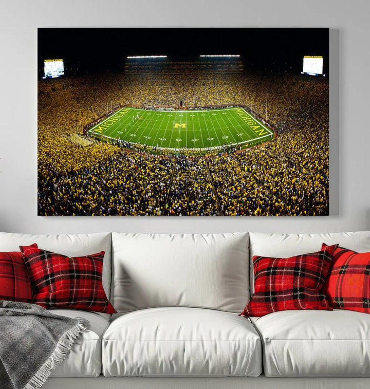 A triptych image vividly captures the electric energy of Michigan Stadium during a night game, with a sea of cheering fans. This Michigan Wolverines Football Team canvas print infuses any home with dynamic spirit and pride.