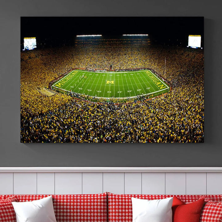 A triptych image vividly captures the electric energy of Michigan Stadium during a night game, with a sea of cheering fans. This Michigan Wolverines Football Team canvas print infuses any home with dynamic spirit and pride.