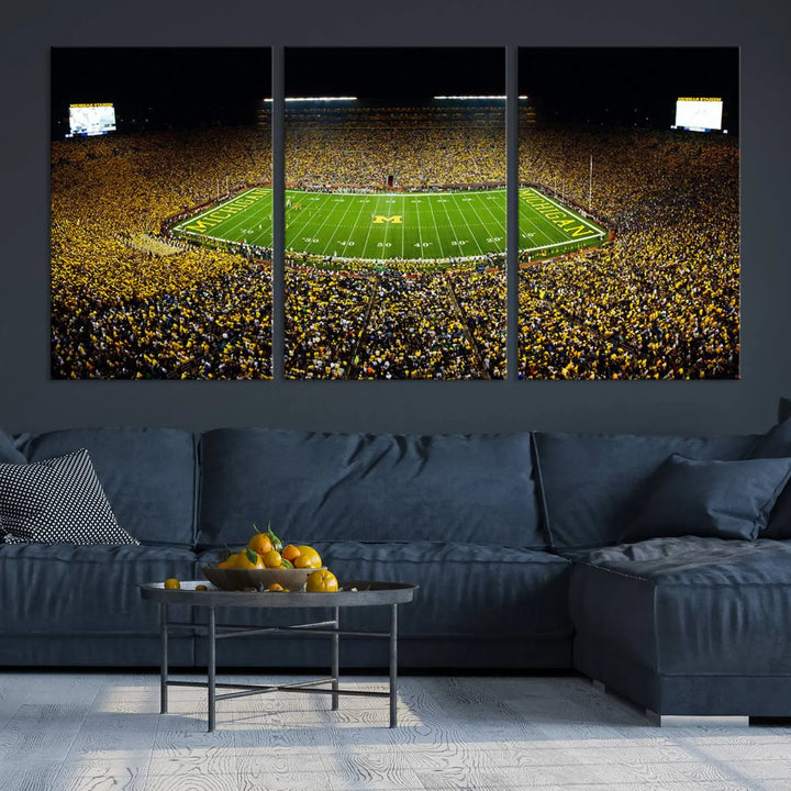 A triptych image vividly captures the electric energy of Michigan Stadium during a night game, with a sea of cheering fans. This Michigan Wolverines Football Team canvas print infuses any home with dynamic spirit and pride.