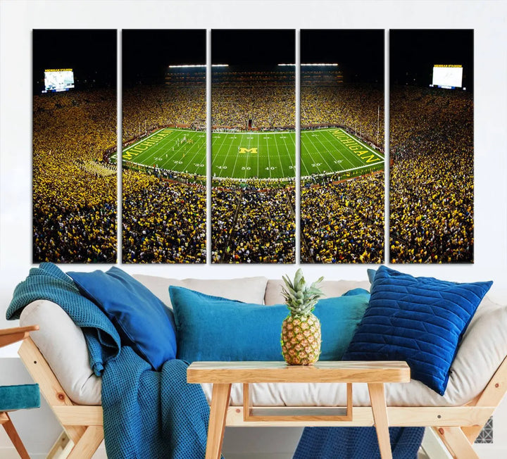 A triptych image vividly captures the electric energy of Michigan Stadium during a night game, with a sea of cheering fans. This Michigan Wolverines Football Team canvas print infuses any home with dynamic spirit and pride.