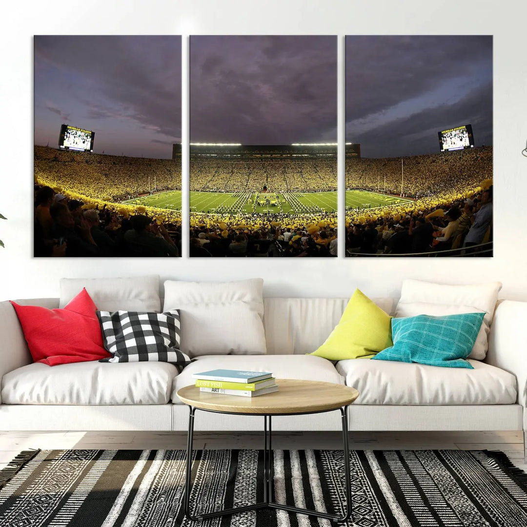 A gallery-wrapped, museum-quality Michigan Wolverines Football Team Print - Michigan Stadium Wall Art Canvas Print is enhanced with a UV-protective coating for lasting vibrancy.