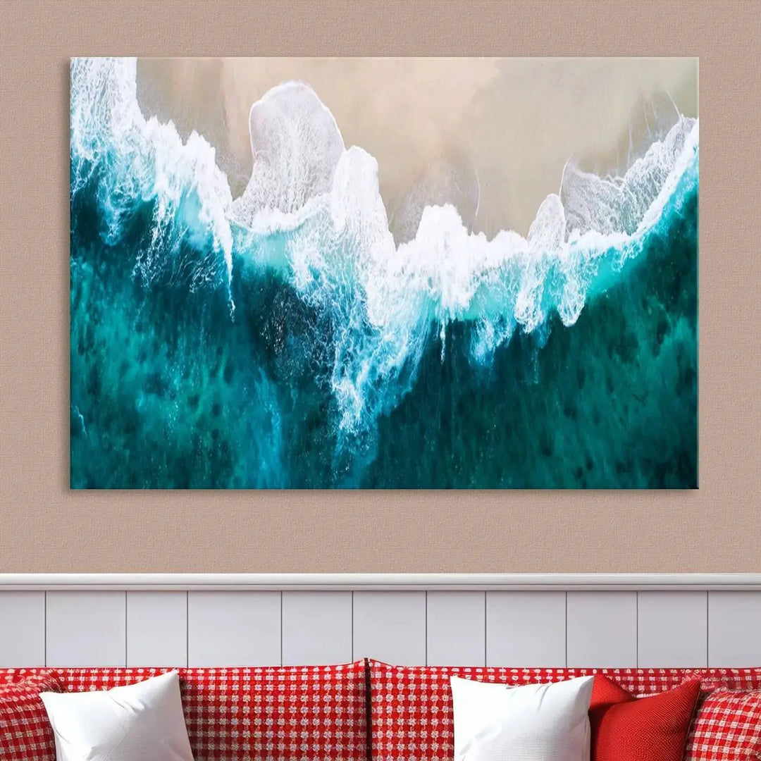 A captivating three-panel "Mind-Blowing Aerial Beach" canvas wall art print, crafted with museum-quality materials and a UV-protective coating, is beautifully hung as the focal point of the room.