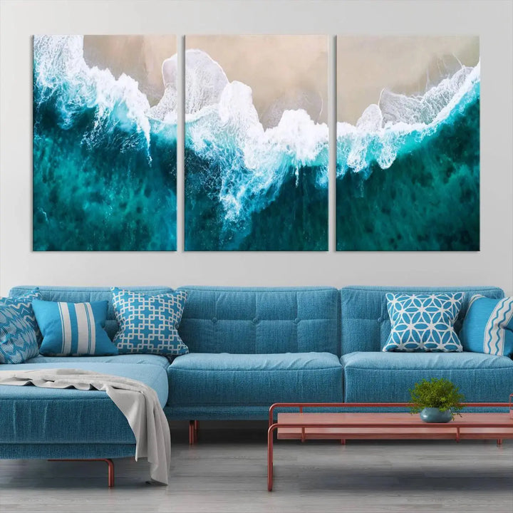 A captivating three-panel "Mind-Blowing Aerial Beach" canvas wall art print, crafted with museum-quality materials and a UV-protective coating, is beautifully hung as the focal point of the room.