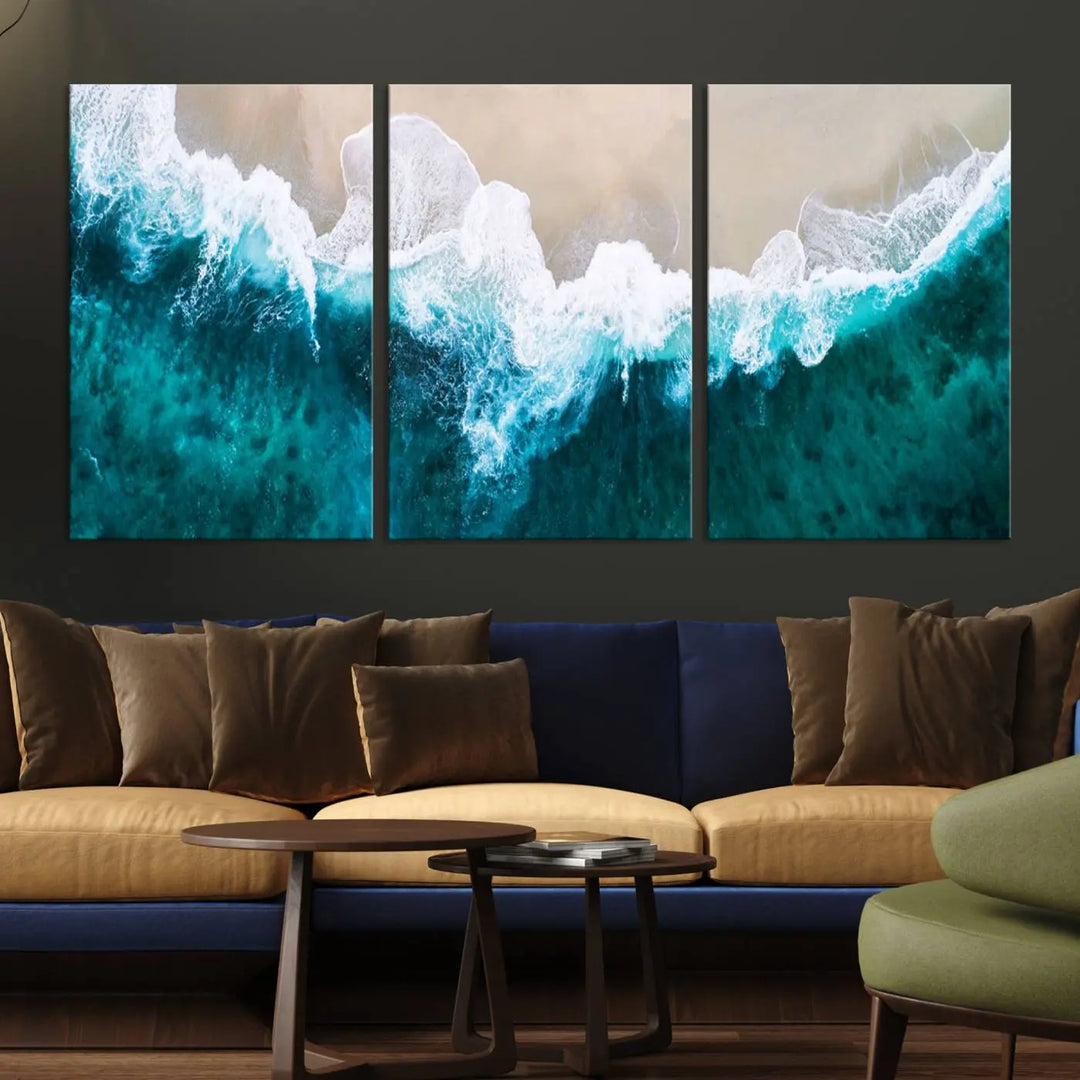 A captivating three-panel "Mind-Blowing Aerial Beach" canvas wall art print, crafted with museum-quality materials and a UV-protective coating, is beautifully hung as the focal point of the room.