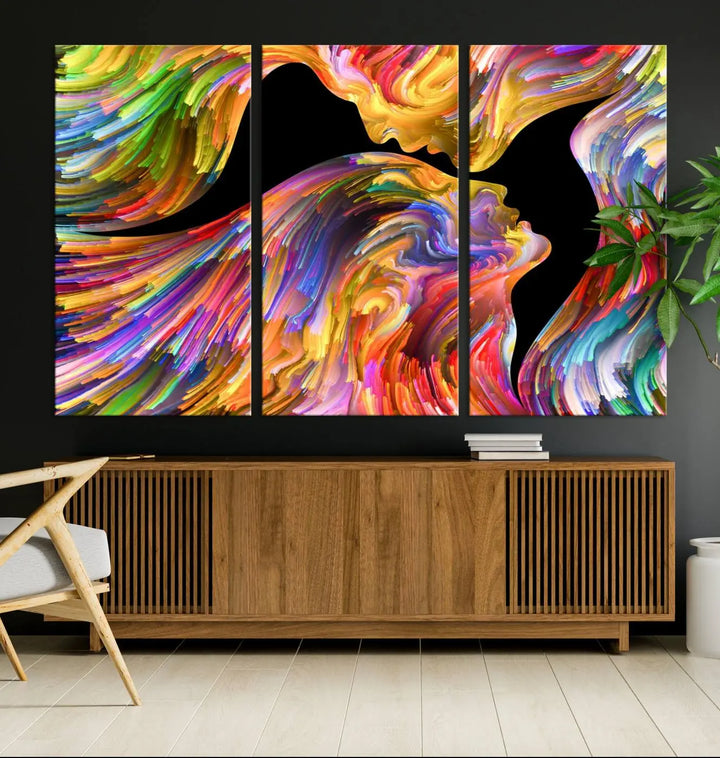 The Mix & Trend Vibrant Colors Abstract Wall Art Canvas Print features a colorful abstract depiction of two faces in profile with vibrant strokes. This museum-quality piece is gallery wrapped and finished with a UV-protective coating to preserve its vivid hues.