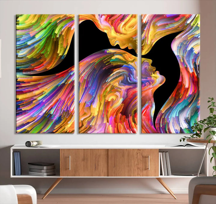 The Mix & Trend Vibrant Colors Abstract Wall Art Canvas Print features a colorful abstract depiction of two faces in profile with vibrant strokes. This museum-quality piece is gallery wrapped and finished with a UV-protective coating to preserve its vivid hues.