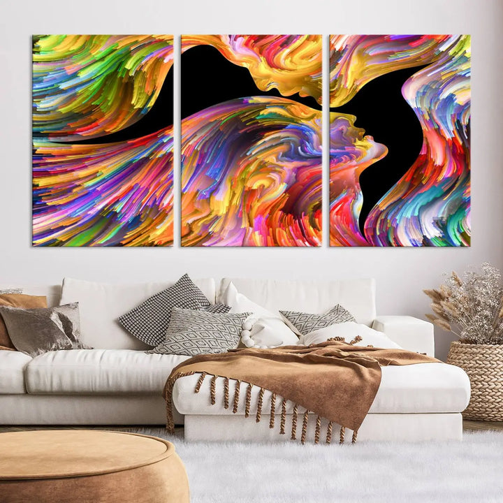 The Mix & Trend Vibrant Colors Abstract Wall Art Canvas Print features a colorful abstract depiction of two faces in profile with vibrant strokes. This museum-quality piece is gallery wrapped and finished with a UV-protective coating to preserve its vivid hues.