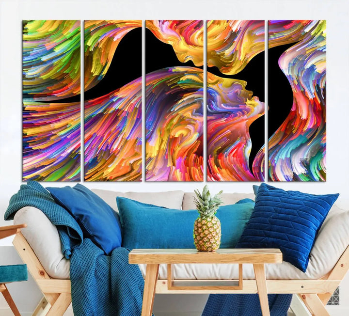 The Mix & Trend Vibrant Colors Abstract Wall Art Canvas Print features a colorful abstract depiction of two faces in profile with vibrant strokes. This museum-quality piece is gallery wrapped and finished with a UV-protective coating to preserve its vivid hues.