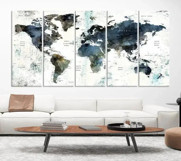 The Modern World Map Canvas Print, a contemporary triptych wall art in blue and white, hangs prominently, offering a global perspective.