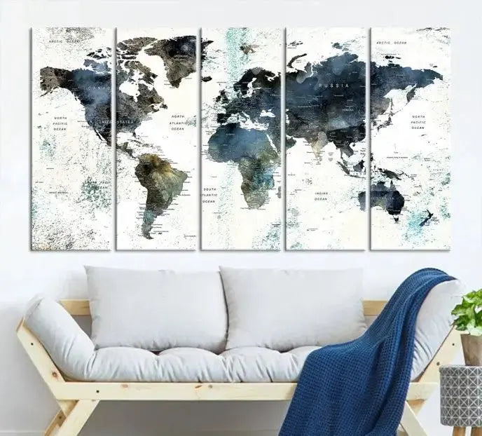 The Modern World Map Canvas Print, a contemporary triptych wall art in blue and white, hangs prominently, offering a global perspective.