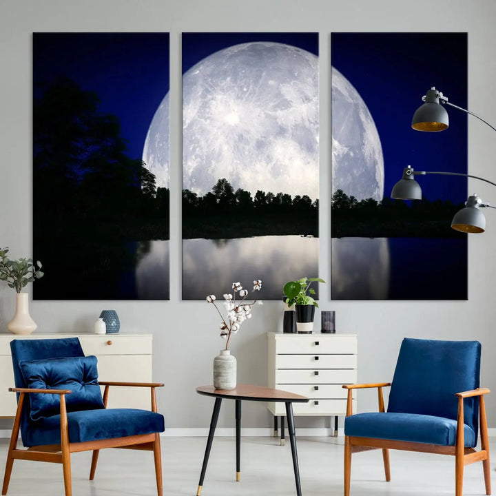 A modern living room showcases a three-panel MoonGlade Wall Art Canvas Print, depicting a moonlit night over a tranquil lake on museum-quality canvases.