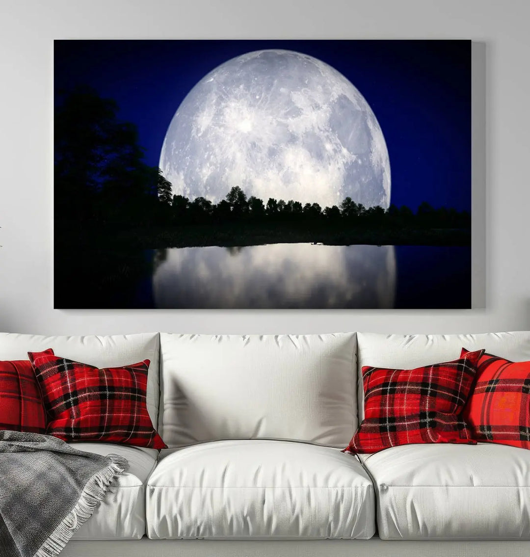 A modern living room showcases a three-panel MoonGlade Wall Art Canvas Print, depicting a moonlit night over a tranquil lake on museum-quality canvases.