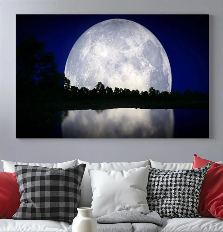 A modern living room showcases a three-panel MoonGlade Wall Art Canvas Print, depicting a moonlit night over a tranquil lake on museum-quality canvases.