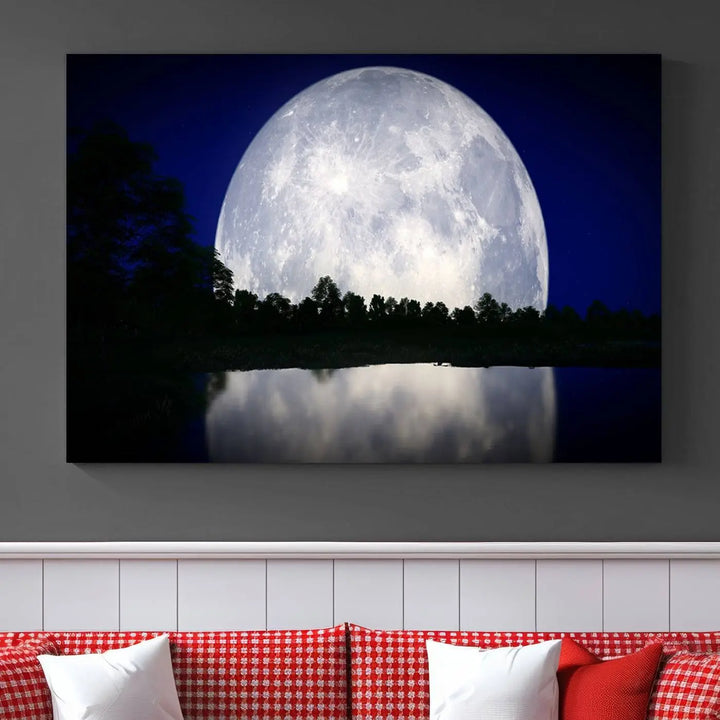 A modern living room showcases a three-panel MoonGlade Wall Art Canvas Print, depicting a moonlit night over a tranquil lake on museum-quality canvases.