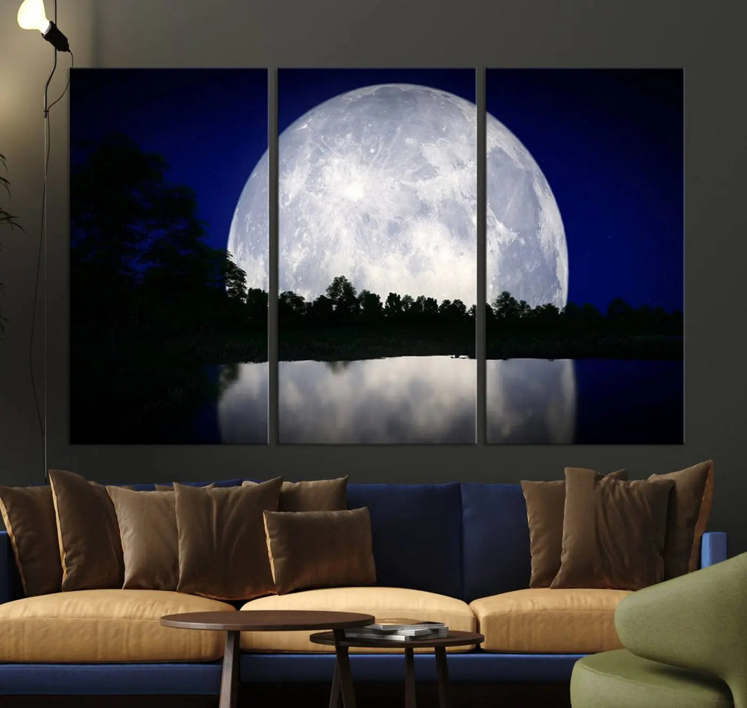 A modern living room showcases a three-panel MoonGlade Wall Art Canvas Print, depicting a moonlit night over a tranquil lake on museum-quality canvases.